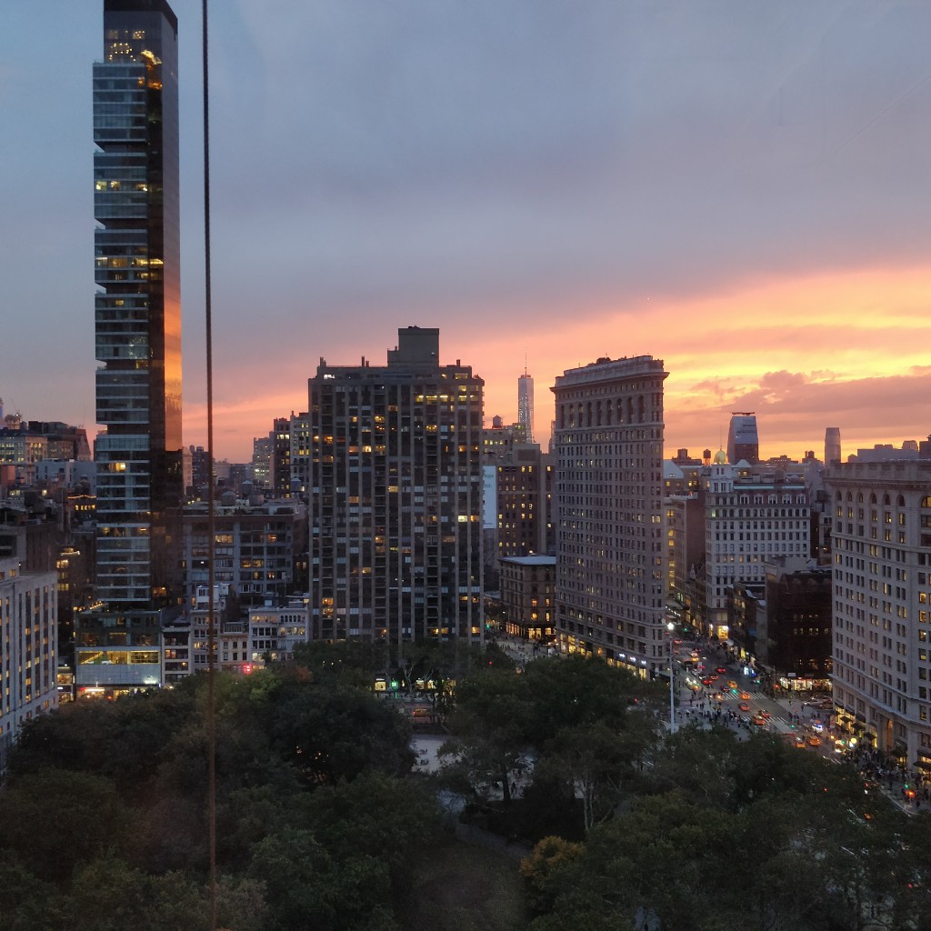 The Flatiron Building and Madison Square Park at sunset